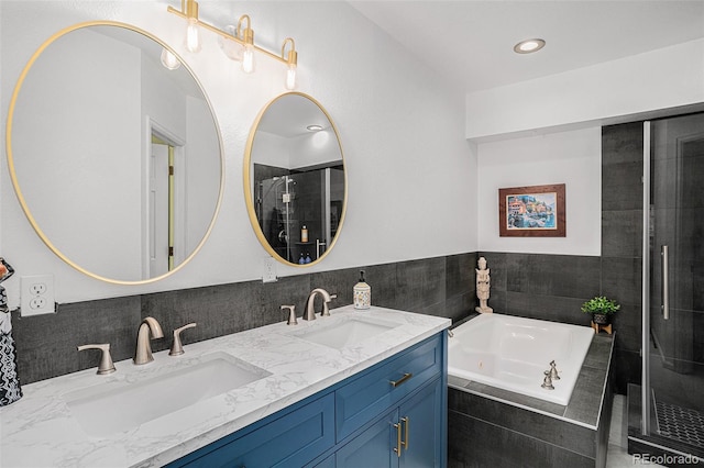403 Captains Ct, Fort Collins, CO 80524 - bathroom featuring a whirlpool tub, double vanity, a tile shower, and recessed lighting