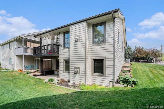 403 Captains Ct, Fort Collins, CO 80524 - rear view of house featuring a patio and a yard