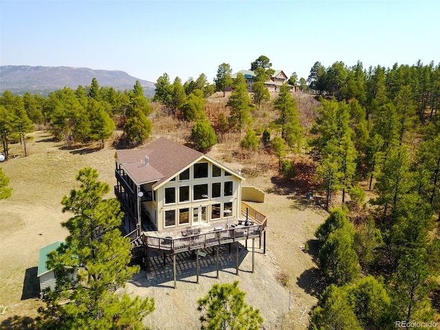 birds eye view of property featuring a mountain view