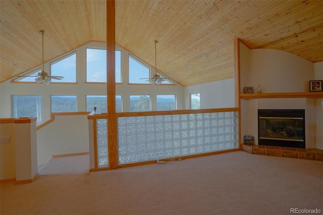 unfurnished living room featuring high vaulted ceiling, ceiling fan, and carpet floors