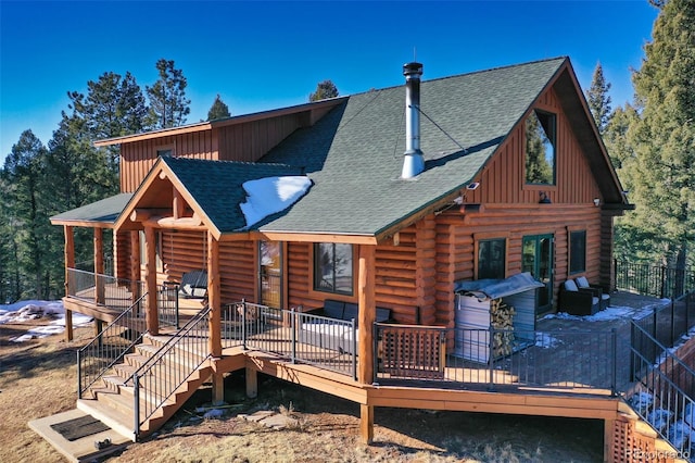 rear view of house with a deck