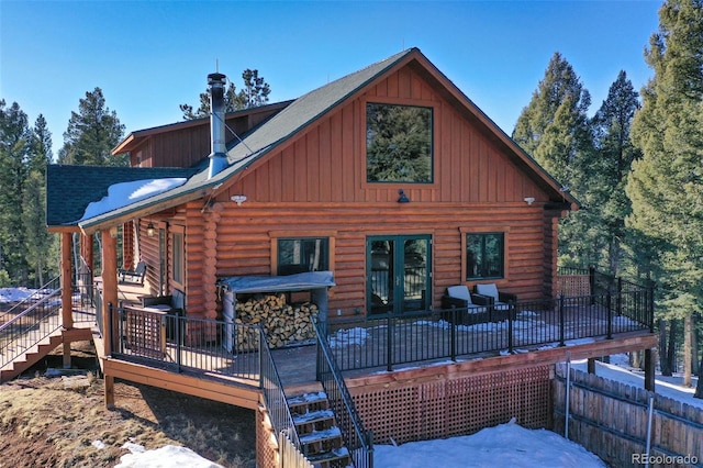 back of property with a wooden deck