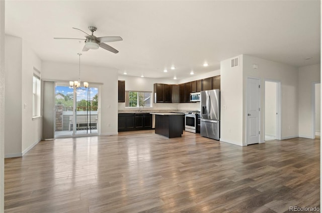 12940 Jasmine St Unit A, Thornton, CO 80602 - unfurnished living room featuring a sink, ceiling fan, a chandelier, recessed lighting, and baseboards