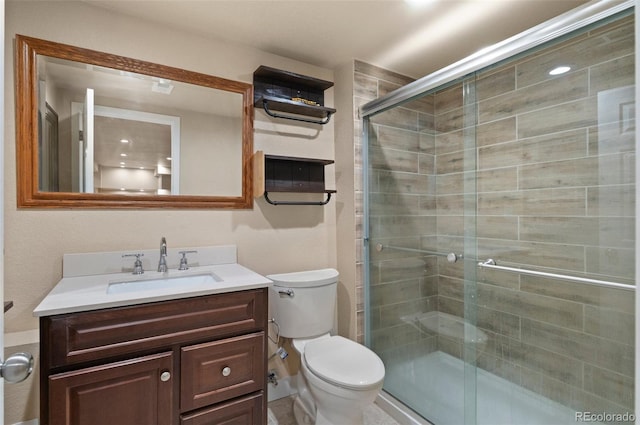 12940 Jasmine St Unit A, Thornton, CO 80602 - bathroom featuring vanity, toilet, and a shower stall