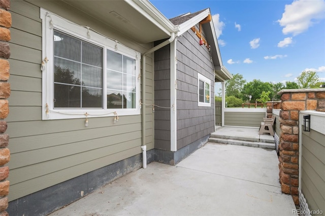 12940 Jasmine St Unit A, Thornton, CO 80602 - view of side of home featuring a patio