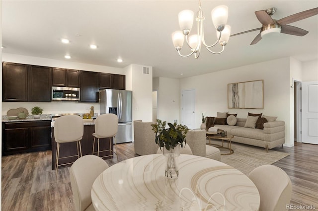 12940 Jasmine St Unit A, Thornton, CO 80602 - living room with wood finished floors, a chandelier, recessed lighting, and ceiling fan