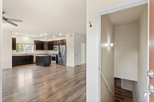 12940 Jasmine St Unit A, Thornton, CO 80602 - kitchen featuring appliances with stainless steel finishes, a sink, dark brown cabinetry, ceiling fan, and light countertops