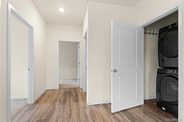 12940 Jasmine St Unit A, Thornton, CO 80602 - laundry room featuring stacked washer / drying machine, wood finished floors, baseboards, and recessed lighting