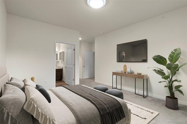 12940 Jasmine St Unit A, Thornton, CO 80602 - bedroom featuring carpet, baseboards, and ensuite bath