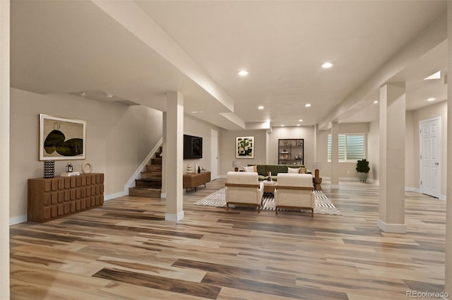 12940 Jasmine St Unit A, Thornton, CO 80602 - living room featuring light wood-style flooring, recessed lighting, baseboards, and stairway