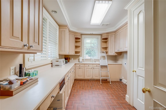 kitchen featuring brick patterned floor, crown molding, open shelves, light countertops, and visible vents