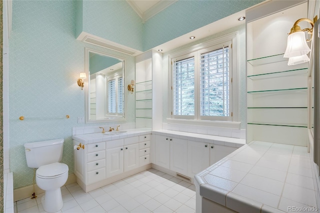 bathroom featuring tile patterned floors, toilet, visible vents, crown molding, and vanity