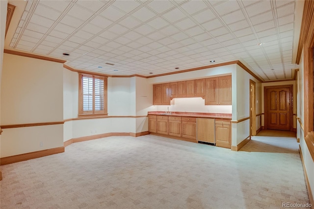 unfurnished bedroom with light carpet, baseboards, and ornamental molding
