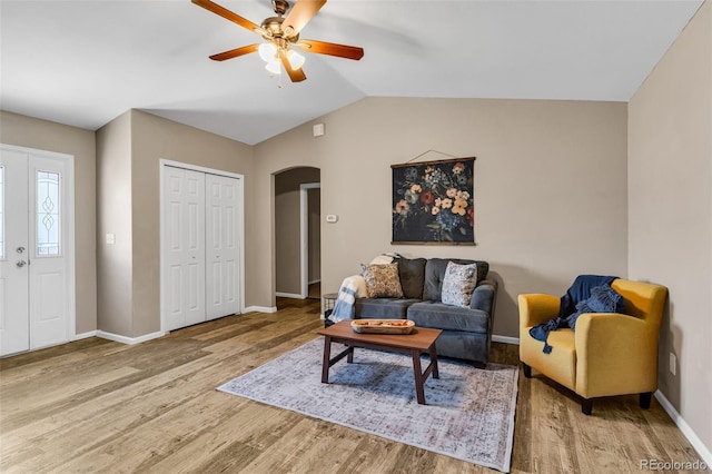 835 Juliana Ct, Canon City, CO 81212 - living room featuring arched walkways, a ceiling fan, baseboards, and wood finished floors