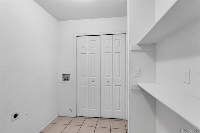 835 Juliana Ct, Canon City, CO 81212 - laundry area with electric dryer hookup, laundry area, hookup for a washing machine, baseboards, and light tile patterned flooring