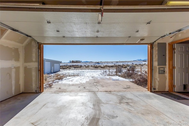 snow covered patio featuring electric panel