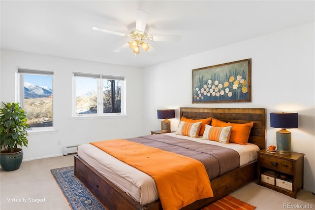 20155 Hideout Ln, Nathrop, CO 81236 - bedroom with light carpet, a baseboard heating unit, and a ceiling fan