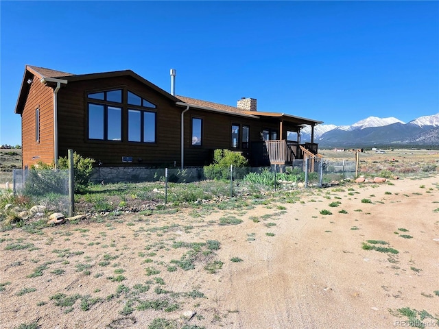 20155 Hideout Ln, Nathrop, CO 81236 - rear view of house with a chimney and a mountain view