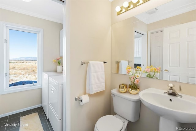 20155 Hideout Ln, Nathrop, CO 81236 - half bathroom with separate washer and dryer, ornamental molding, and tile patterned flooring