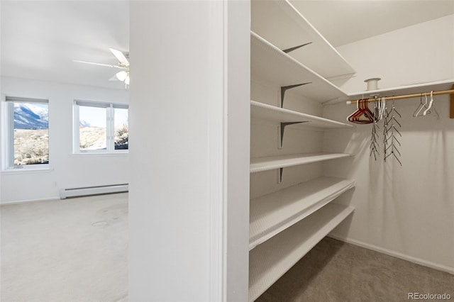 20155 Hideout Ln, Nathrop, CO 81236 - spacious closet with carpet flooring, a baseboard radiator, and a ceiling fan