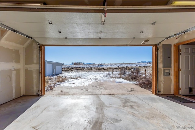 20155 Hideout Ln, Nathrop, CO 81236 - snow covered garage featuring electric panel and a mountain view