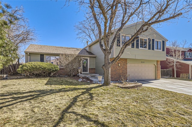 split level home featuring driveway, an attached garage, fence, a front lawn, and brick siding