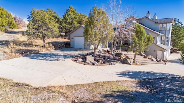 249 Valle Escondido Dr, Durango, CO 81303 - view of property hidden behind natural elements featuring a chimney and driveway