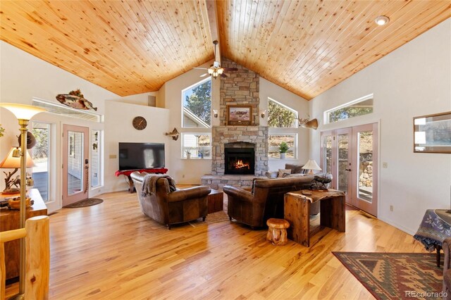 249 Valle Escondido Dr, Durango, CO 81303 - living room with light wood finished floors, a ceiling fan, high vaulted ceiling, a fireplace, and wooden ceiling