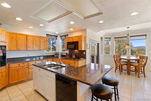 249 Valle Escondido Dr, Durango, CO 81303 - kitchen featuring a sink, a textured ceiling, black appliances, recessed lighting, and light tile patterned floors