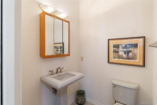 249 Valle Escondido Dr, Durango, CO 81303 - half bathroom with toilet and baseboards