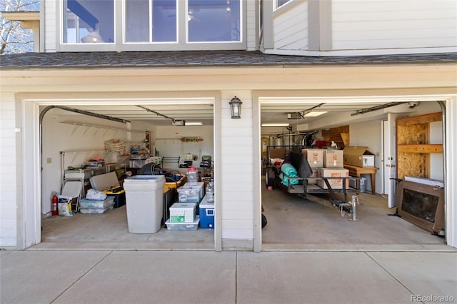 249 Valle Escondido Dr, Durango, CO 81303 - garage with driveway and a garage door opener