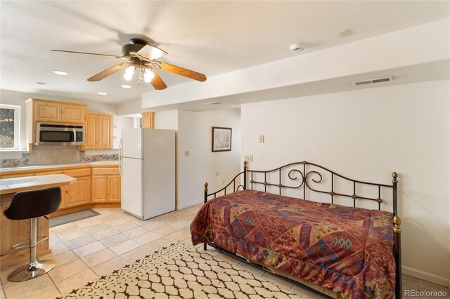 249 Valle Escondido Dr, Durango, CO 81303 - bedroom with freestanding refrigerator, visible vents, recessed lighting, light tile patterned floors, and baseboards