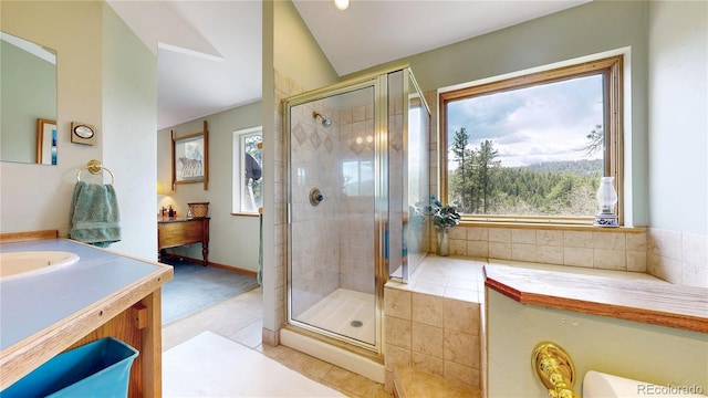 2545 N State Highway 67, Sedalia, CO 80135 - bathroom featuring vaulted ceiling, vanity, tile patterned floors, and a stall shower