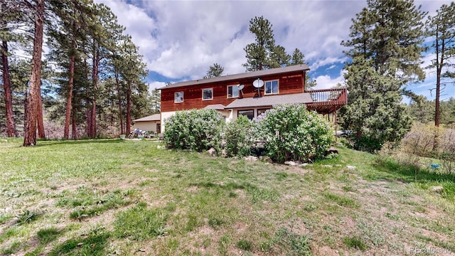 2545 N State Highway 67, Sedalia, CO 80135 - back of house with a lawn and a deck