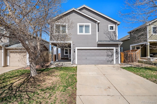 traditional-style home with driveway and a garage