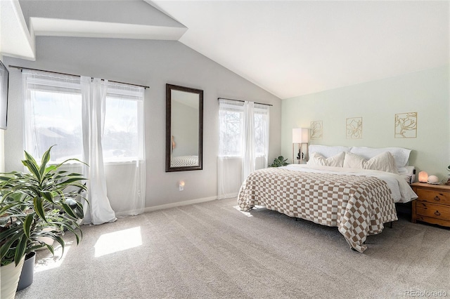 bedroom with baseboards, vaulted ceiling, and carpet floors