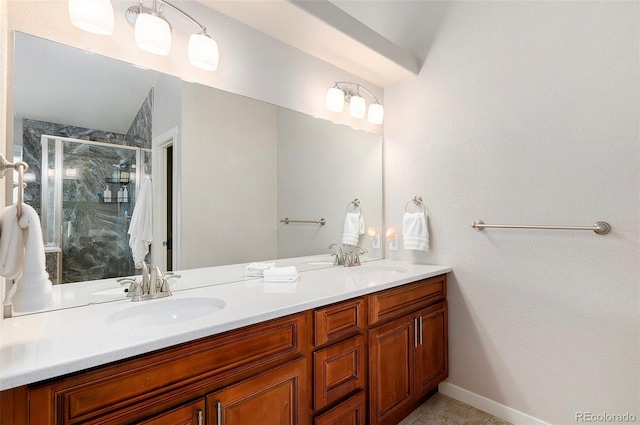 full bathroom featuring tile patterned flooring, double vanity, a sink, and a stall shower