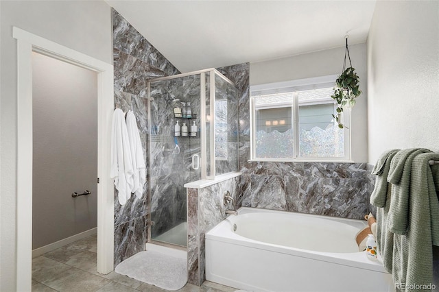 bathroom featuring a stall shower and a garden tub
