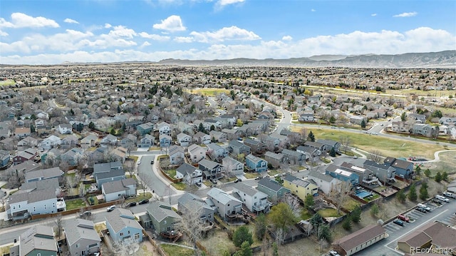birds eye view of property with a mountain view and a residential view