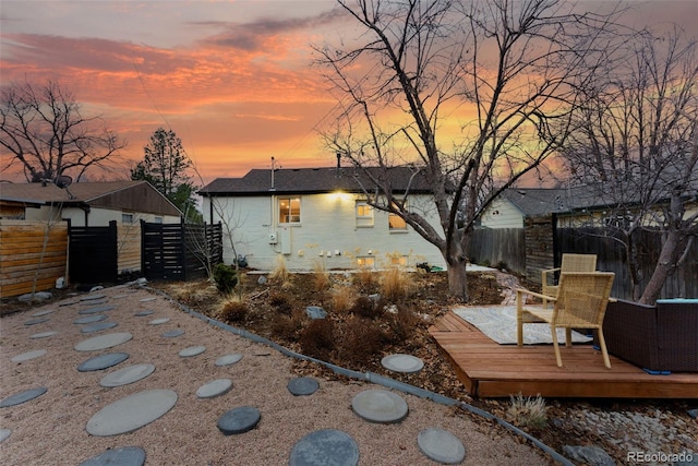 exterior space featuring fence and a wooden deck