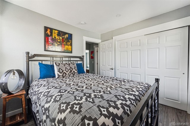 bedroom with a closet and wood finished floors