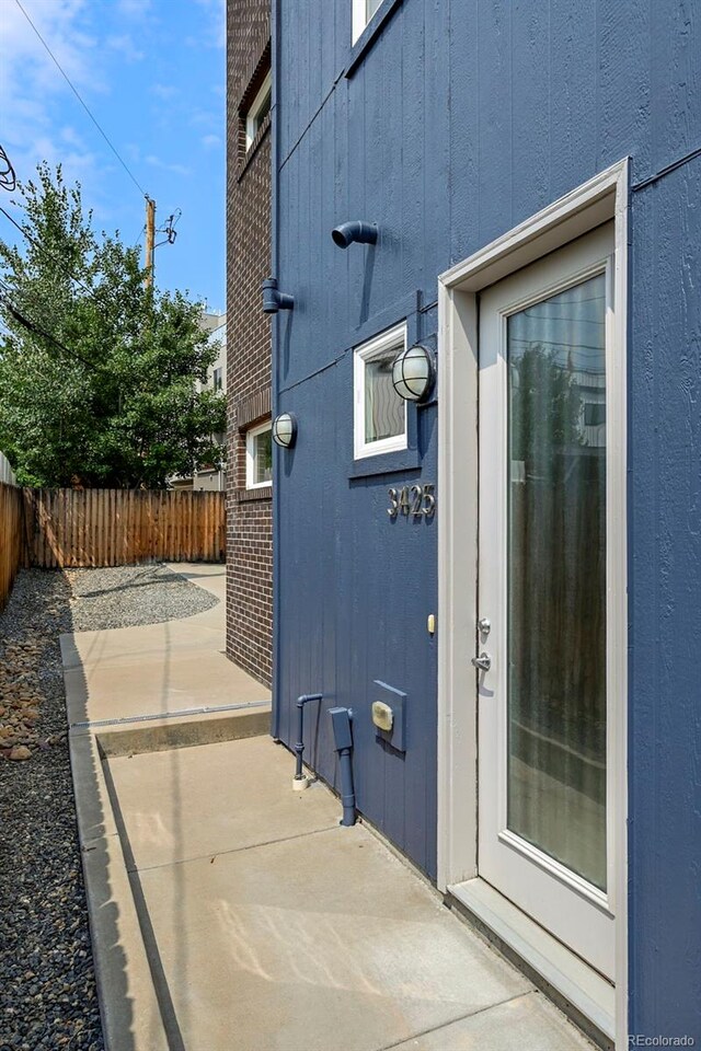 view of side of property featuring a patio