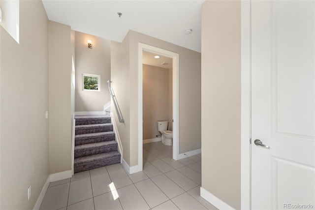 stairway featuring tile patterned floors