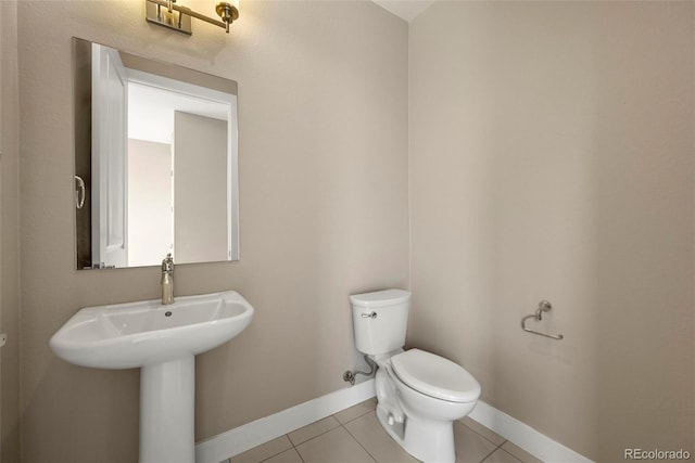 bathroom with tile patterned floors and toilet