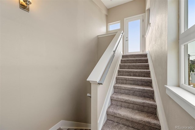 staircase featuring a wealth of natural light