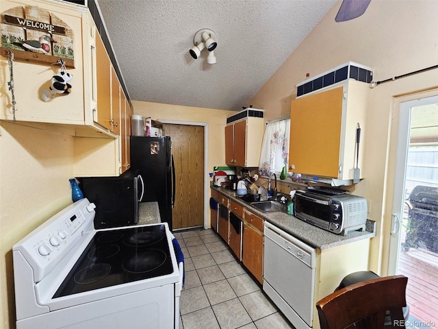 4677 S Salida St, Aurora, CO 80015 - kitchen featuring white appliances, a sink, vaulted ceiling, a textured ceiling, and light tile patterned floors