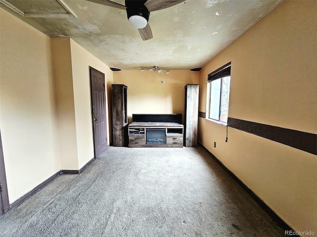 4677 S Salida St, Aurora, CO 80015 - unfurnished living room with carpet floors and ceiling fan