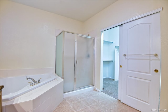 bathroom with tile patterned flooring and plus walk in shower