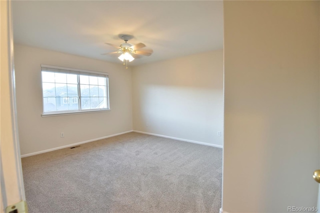 carpeted empty room with ceiling fan