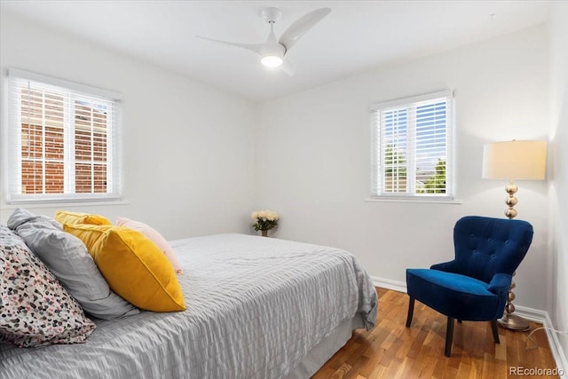 3739 W 46th Ave, Denver, CO 80211 - bedroom with wood finished floors, baseboards, and ceiling fan